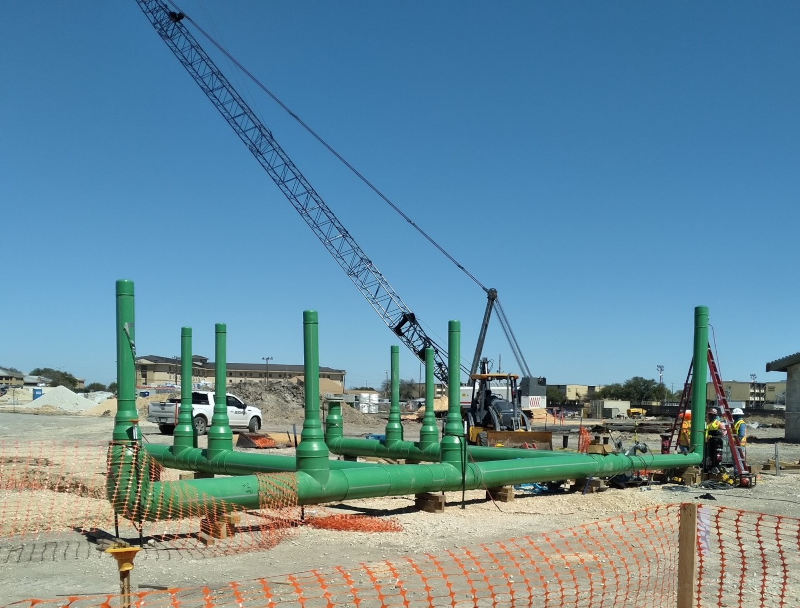 The Air Force’s new basic training facility required large diameter pipe and fittings to move 155ºF (68ºC) water effectively throughout the campus at 90 psi. Using PP-RCT pipe also enabled sections of the system to be fabricated and lifted into the trench. Courtesy: Asahi/America