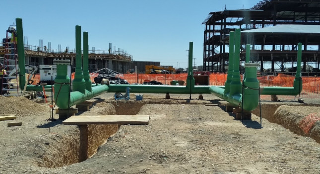The Air Force’s new basic training facility required large diameter pipe and fittings to move 155ºF (68ºC) water effectively throughout the campus at 90 psi. Using PP-RCT pipe also enabled sections of the system to be fabricated and lifted into the trench. Courtesy: Asahi/America