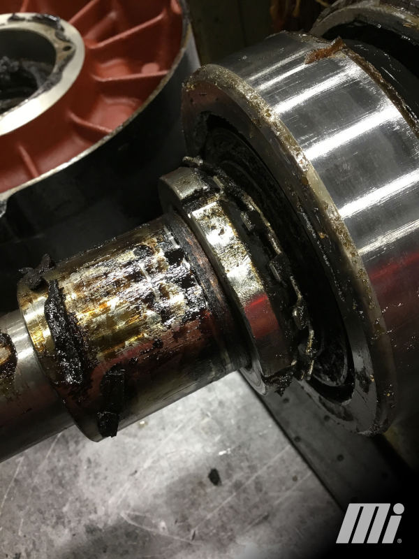 Overgreasing creates additional heat and failure of equipment, as shown here. This motor bearing and shaft are dripping with grease, while one can see the grease-filled motor end bell housing. Courtesy: Motion.