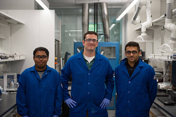 Chris Arges (center), Penn State associate professor of chemical engineering, stands with chemical engineering doctoral students Mahmudul Hasan (left) and Tanmay Kulkarni (right). The team will work in the Nanofabrication Lab in Penn State's Materials Research Institute to design and test membranes. Credit: Kelby Hochreither/Penn State. All Rights Reserved.