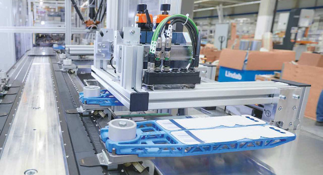 3D-printed blister grabbers travel along an 11-meter-long XTS circuit between one HSPP system