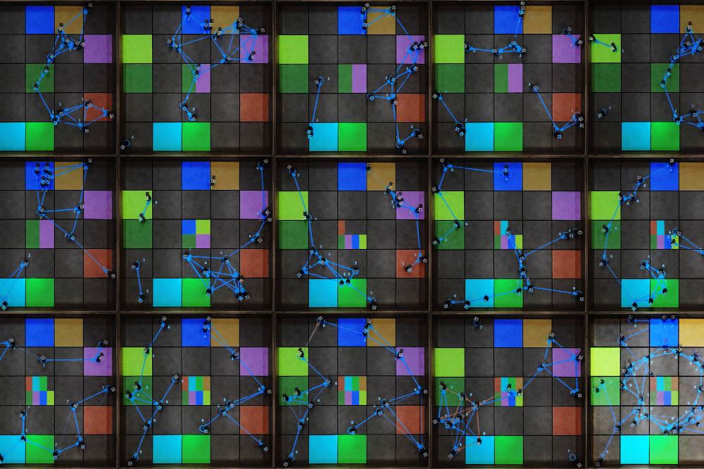 This image shows a team of robots collaborating to search for and then retrieve lost objects. The use of blockchain technology could enable secure, tamper-proof communication among the robots as they complete their task, according to new research from MIT. Courtesy: Massachusetts Institute of Technology
