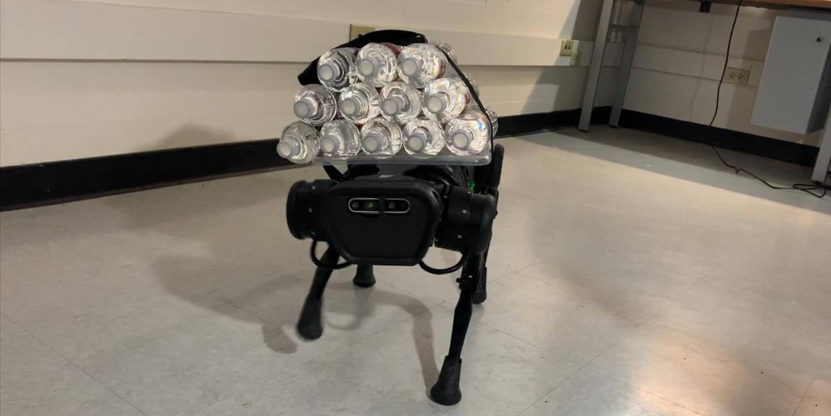A quadruped robot from USC Viterbi assistant professor Quan Nguyen's lab carries half its body weight in water bottles. Courtesy: Mohsen Sombolestan, USC Viterbi