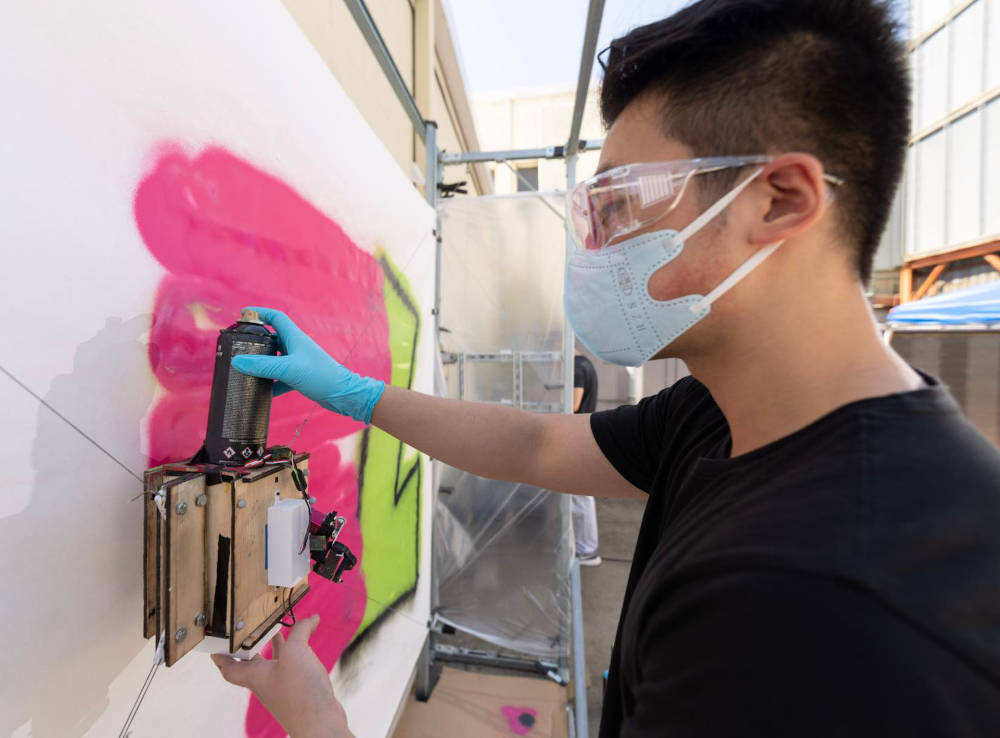 Michael Qian loads in the spray paint can on GTGraffiti. Courtesy: Rob Felt, Georgia Institute of Technology