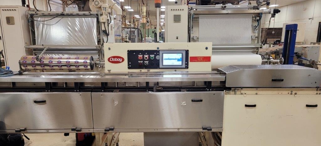 An overview picture showing the wrapper (right) and smart indexing conveyor (left and middle).