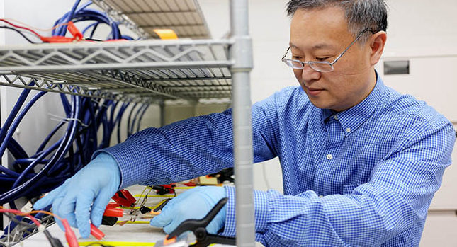 a U-M professor of mechanical engineering cycling batteries in the Lu Lab. Photo: Brenda Ahearn. Courtesy: University of Michigan.