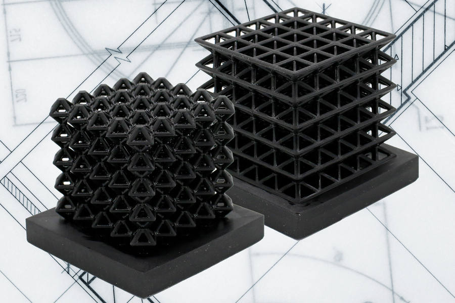 This image shows 3D-printed crystalline lattice structures with air-filled channels, known as "fluidic sensors," embedded into the structures (the indents on the middle of lattices are the outlet holes of the sensors.) These air channels let the researchers measure how much force the lattices experience when they are compressed or flattened. Courtesy: Massachusetts Institute of Technology (MIT)