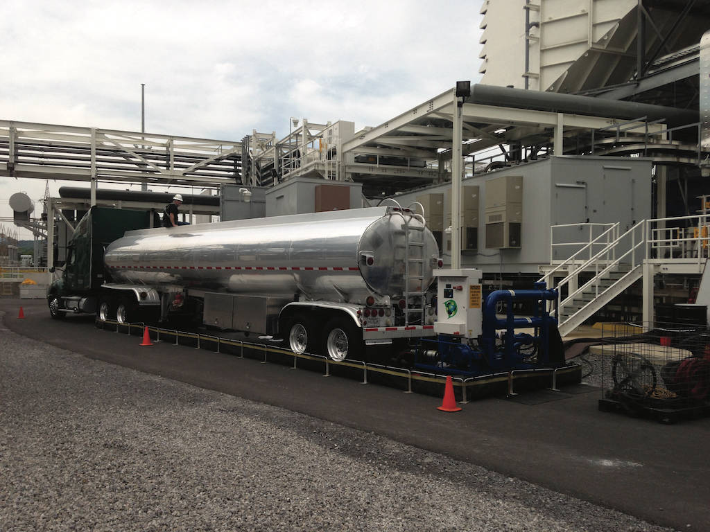 Figure 1: Pre-filtration unit (white box) between tanker truck and customer’s storage tank. Courtesy of Dilmar Oil Co., Inc.
