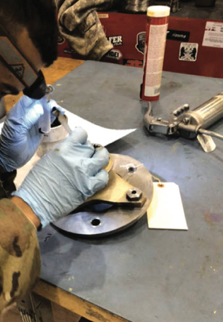 Figure 6: In a project to test in-service greases for Chinook H-47 helicopters, a soldier took a grease sample, and the sample size was frequently less than 1 gram. Courtesy: MRG Labs
