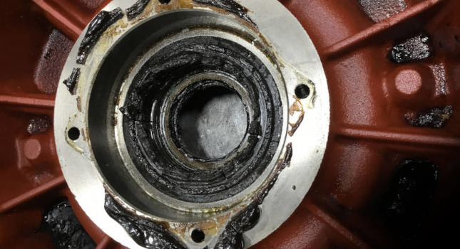 as shown here. This motor bearing and shaft are dripping with grease.
