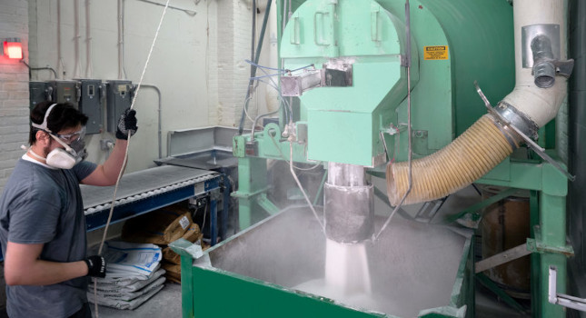 The hot melt adhesives mixtures are dumped into a bin.