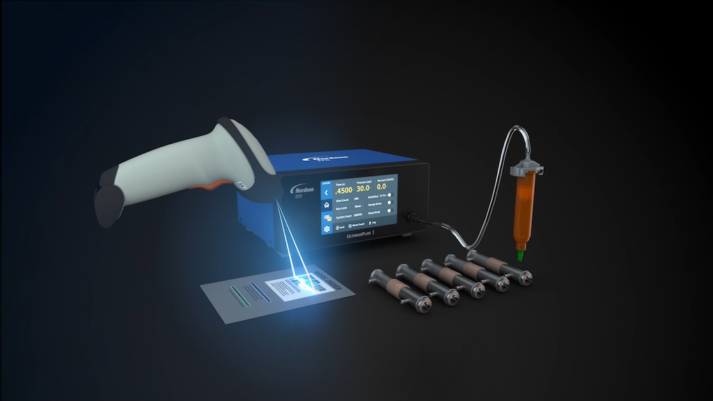Figure 3: Ultimus I benchtop fluid dispenser applying UV-cure adhesive onto a medical device. Courtesy: Nordson EFD
