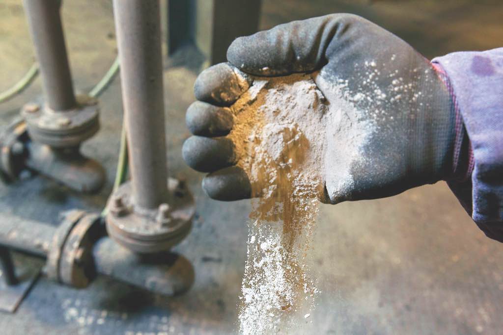 Figure 4: A near-constant high velocity stream of abrasives, such as metallic additives and sand, make wear of pneumatic lines a concern. Courtesy: Waupaca Foundry