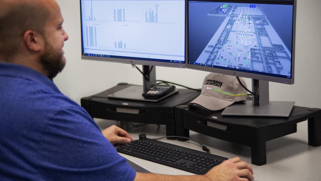 Figure 3: Robert DeGroot monitors his team's KPIs and the production facility's digital twin. Courtesy: Phoenix Contact
