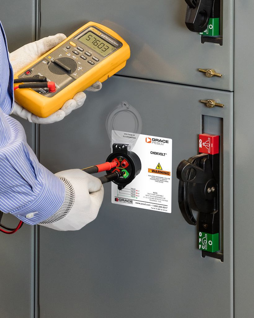 Figure 3: A qualified electrician taking a voltage reading using a safe test point permanent electrical safety device and his portable test instrument. Courtesy: Grace Technologies