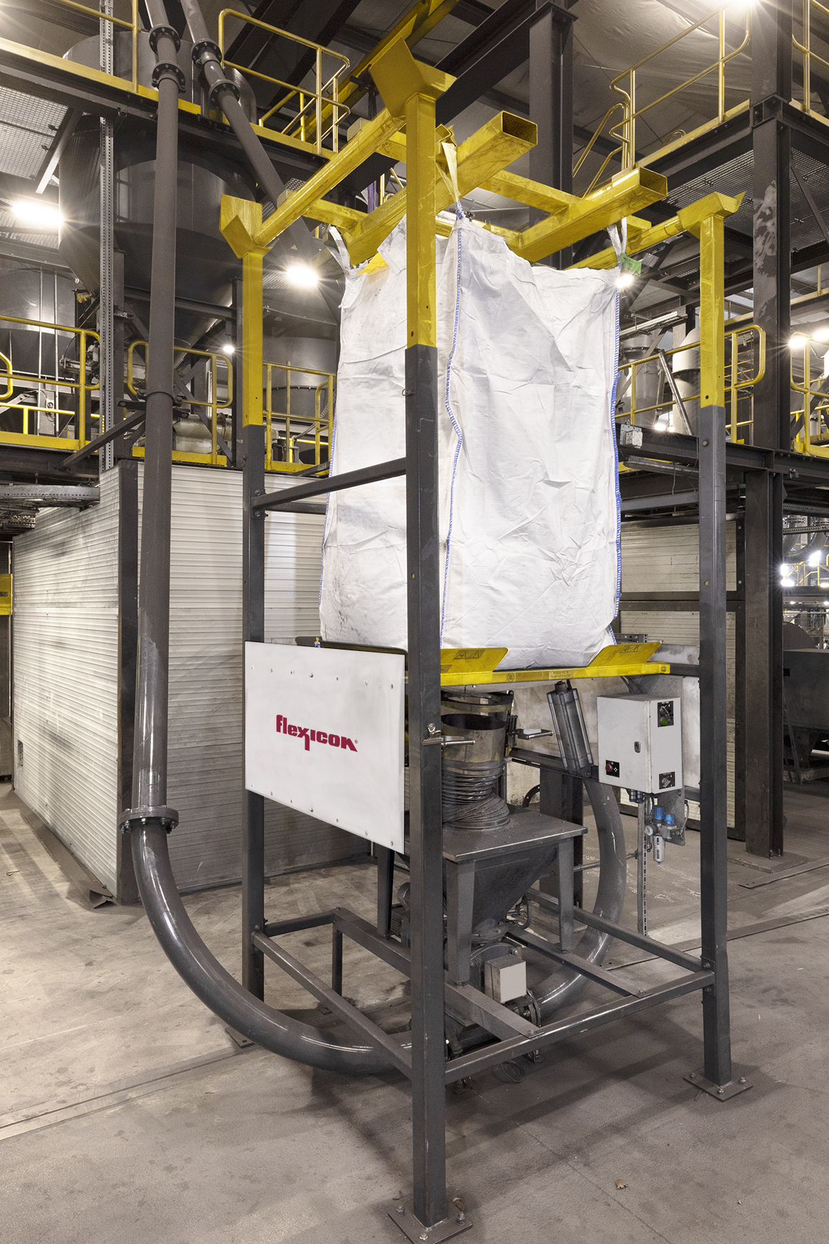 Figure 3: A rotary valve beneath each hopper feeds graphite to a tubular cable conveyor, which gently moves it dust-free to a jet mill for fine grinding. Courtesy: Flexicon