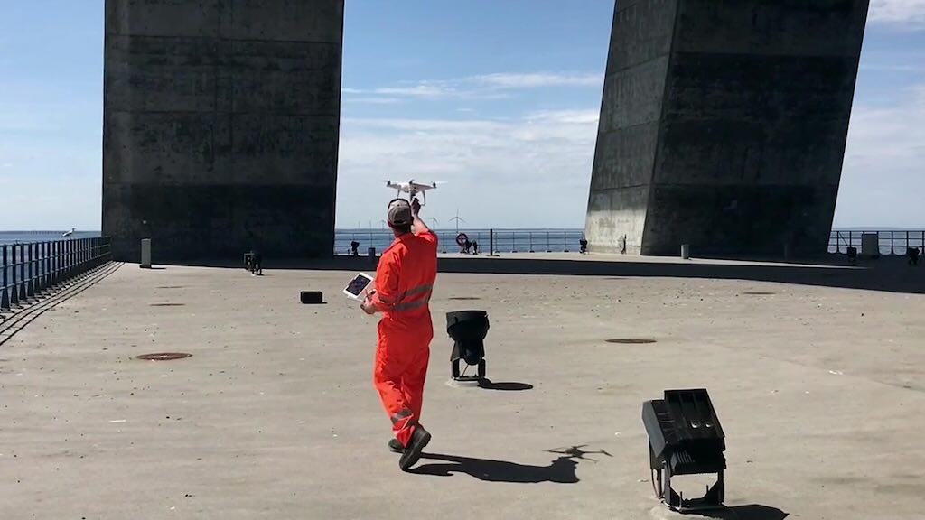 Figure 3: A bridge management engineer launches a drone to collect maintenance data.