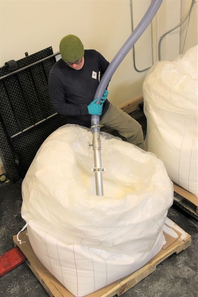 Figure 1: Vacuum conveying allows change from manual bag dumping to bulk bags for lower cost of materials.