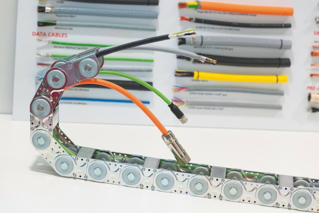 Drag chains are often used to securely connect cables and wires to moving machine parts.
