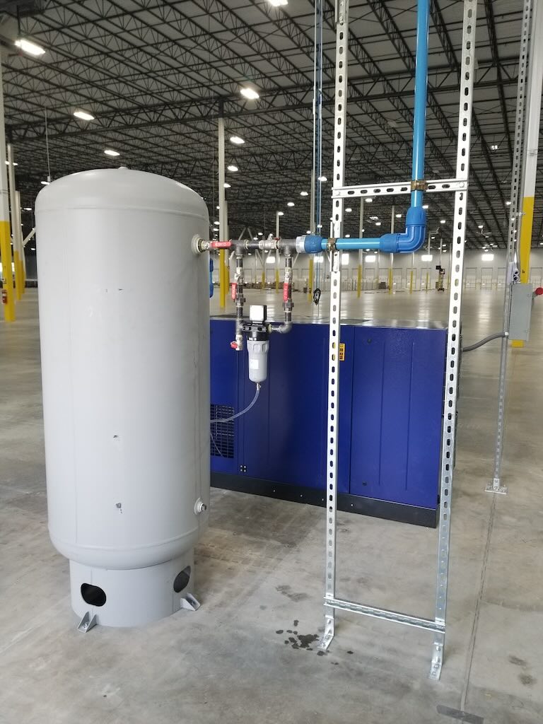 Figure 1: Aluminum piping connection to air compressor with compression fittings.
