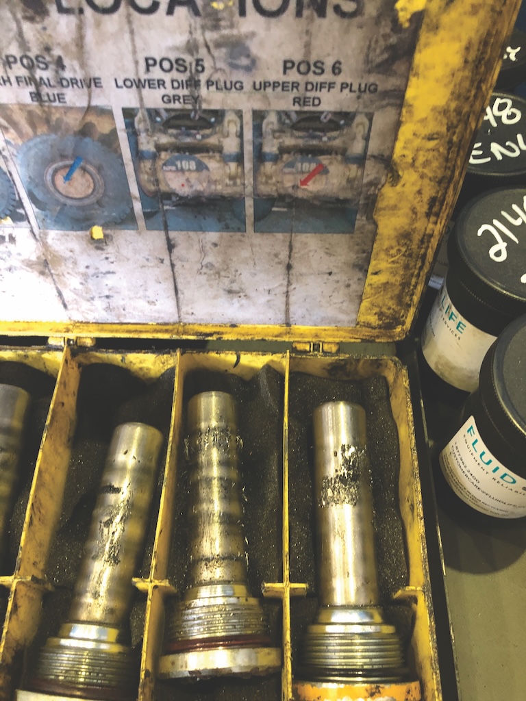 Figure 2: Magnetic plugs in the oil stream of heavy, off-road vehicles capture magnetic debris for laboratory analysis.