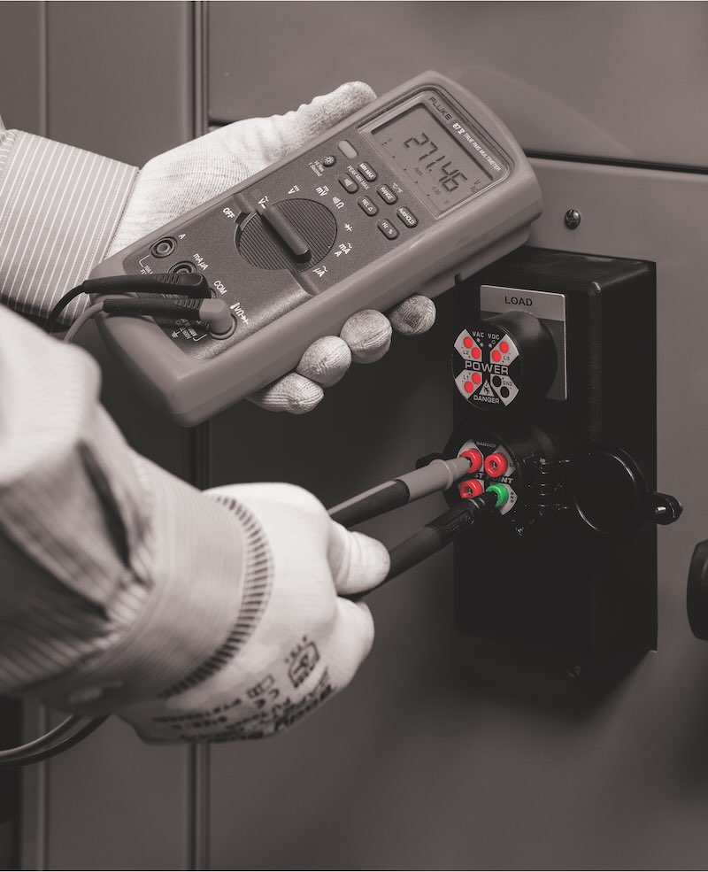 Figure 3: Portable test instrument taking a reading through a UL 61010 test point permanent electrical safety device (PESD). Courtesy: Grace Technologies Inc.