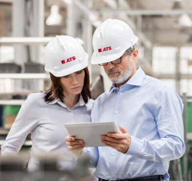 Figure 1: Two engineers discuss advanced technologies, exemplifying the human-machine collaboration central to the transition to industry 5.0.