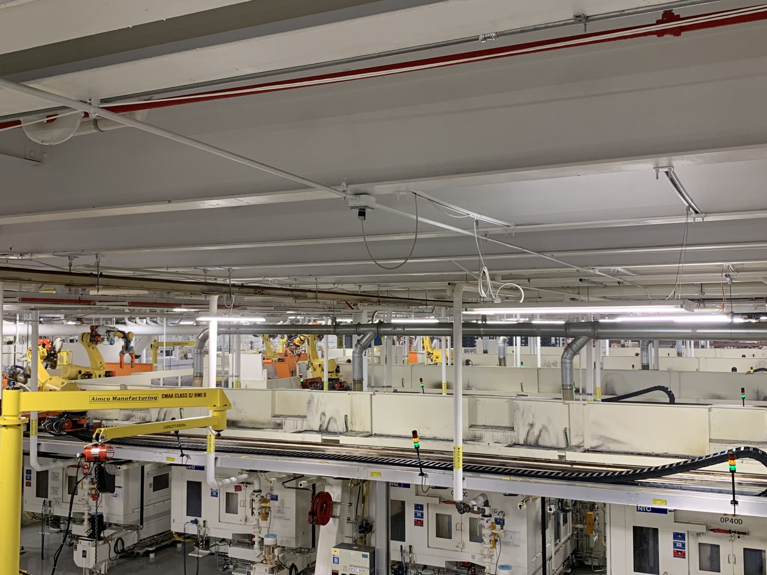 Figure 2: A robot loads five computer numerical control machines. Courtesy: Patti Engineering