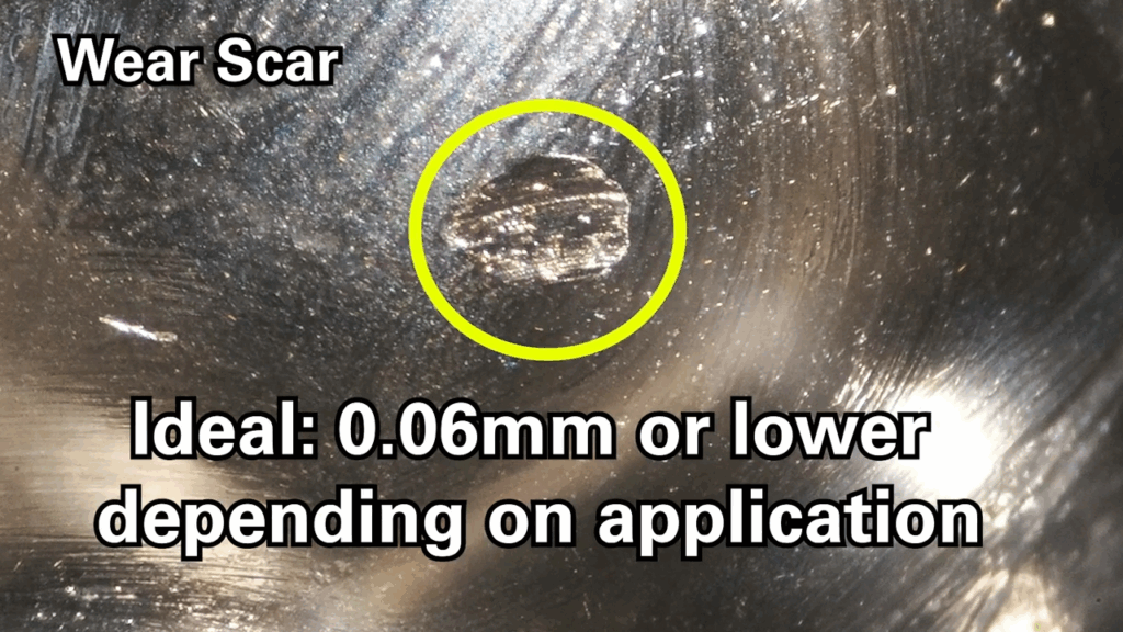 Figure 1: A ball wear test shows the wear scar measurement on a lubricated surface. A smaller wear scar indicates better protection against metal-to-metal contact. High-performance extreme pressure greases with molybdenum disulfide or other anti-wear additives help extend component life by reducing friction and wear. Courtesy: CITGO Petroleum