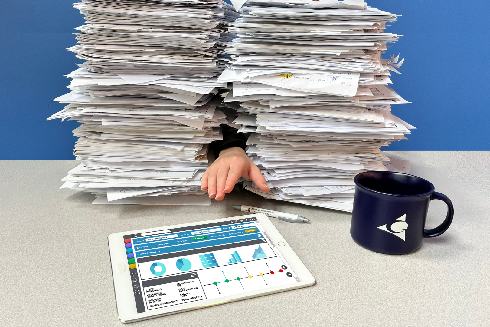 Figure 2: A hand reaches from a pile of paperwork toward a digital dashboard, signaling the shift toward efficient, paperless operations. Courtesy: Applied Control Engineering