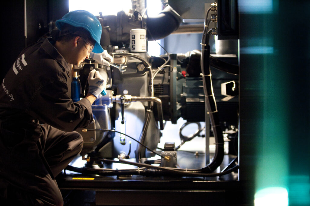 Figure 3: A service technician performs preventive maintenance to keep air compressors running optimally. Courtesy: Atlas Copco Compressors