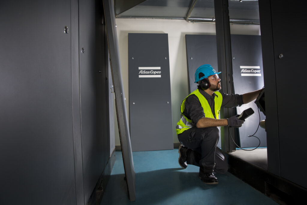 Figure 4: A service technician performs a shock pulse measurement as part of a preventive maintenance plan. Courtesy: Atlas Copco Compressors