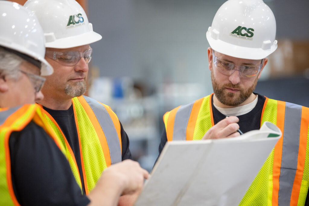 Figure 5: Team members review a detailed written report of a "near miss" to turn a potential failure into a learning opportunity. Courtesy: ACS