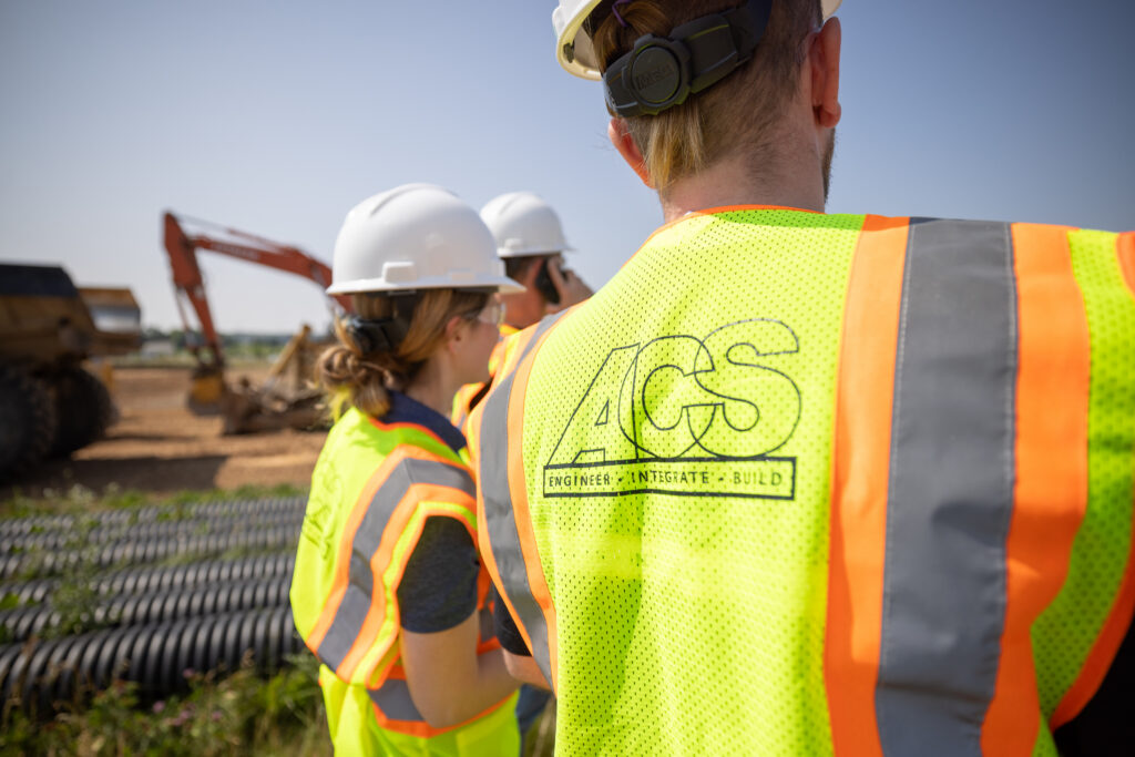 Figure 4: Management demonstrates active participation and visibility, wearing required high-visibility vests and hard hats while supervising the site. Courtesy: ACS