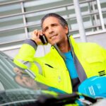 Figure 1: Service technician on the phone. Courtesy: Atlas Copco Compressors