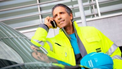 Figure 1: Service technician on the phone. Courtesy: Atlas Copco Compressors