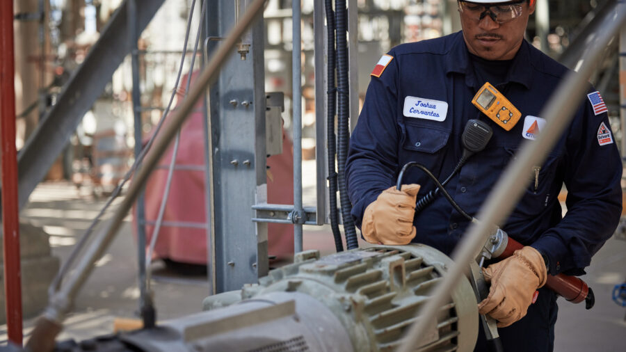 Figure 1: Operator monitors equipment with a vibration monitor to ensure the equipment is running smoothly. Courtesy: CITGO Petroleum Corp.