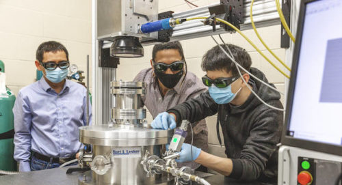 From left: Assistant Professor Lianyi Chen and PhD students Luis Escano and Minglei Qu study metal 3D printing in Chen’s lab. Courtesy: Renee Meiller, University of Wisconsin-Madison