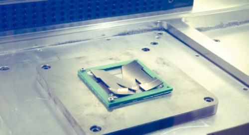 A steel plate in the shape of a Block M is marked with a laser inside the LPBF Panda 11 printer. Photo: Evan Dougherty/Michigan Engineering. Courtesy: University of Michigan